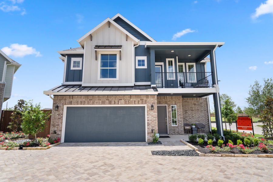 Front exterior of a new home in Elyson, Katy, TX, highlighting curb appeal (Image 16).