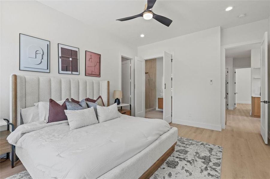 Bedroom featuring ceiling fan and light wood-type flooring