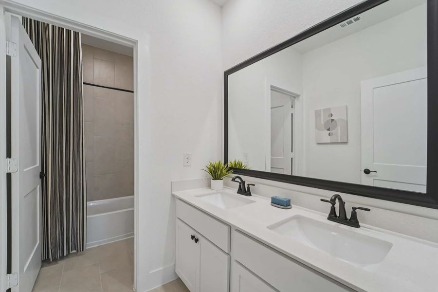 Representative furnished interior of a home built from the Versailles by Chesmar Homes in Bridgeland Chateau, Cypress (Image 12).