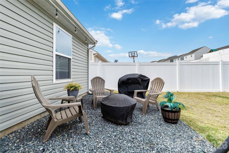 Exterior details and patio area of a home in McKee Creek Village, Charlotte (Image 24).