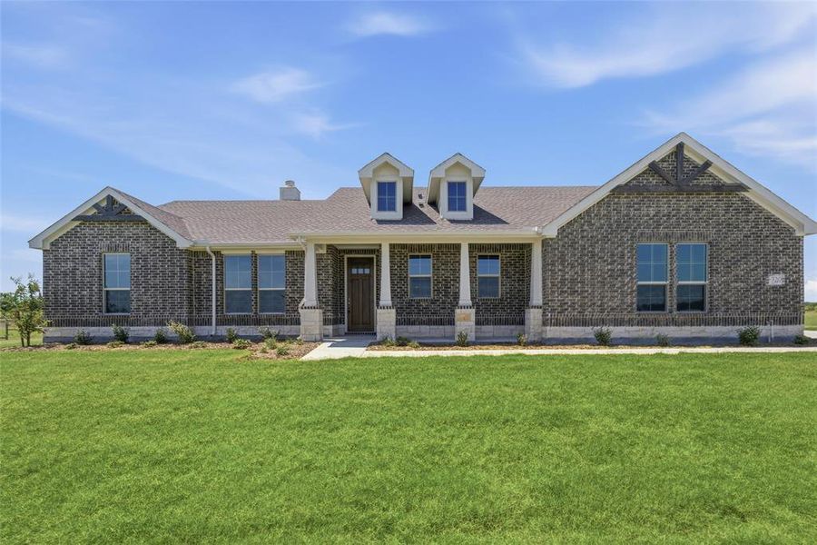 Ranch-style residence featuring a dark brick exterior and a gabled roofline Ranch-style residence featuring a dark brick exterior and a gabled roofline