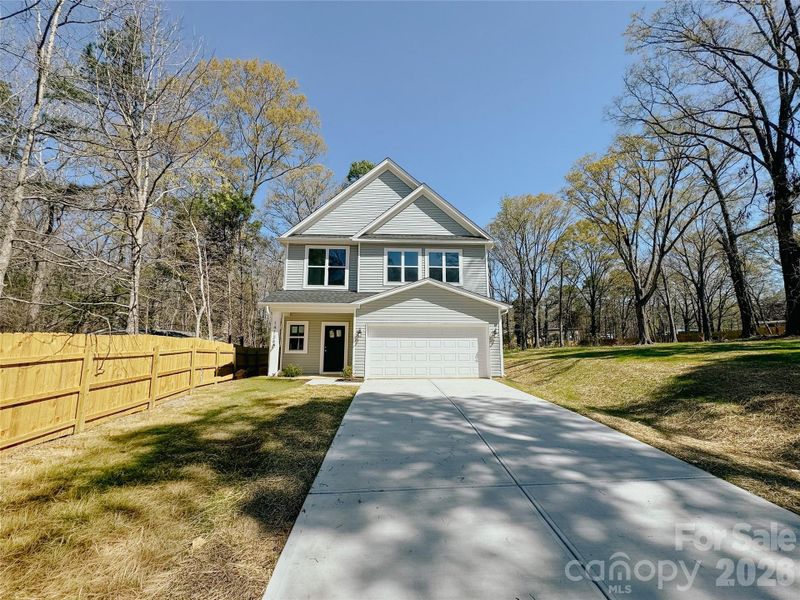 Front exterior of a new home in , Huntersville, NC, highlighting curb appeal (Image 1). Front exterior of a new home in , Huntersville, NC, highlighting curb appeal (Image 1).