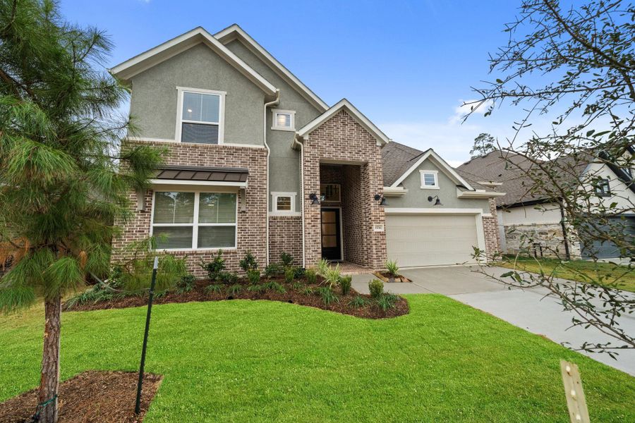 Front exterior of a new home in Evergreen, Conroe, TX, highlighting curb appeal (Image 24).