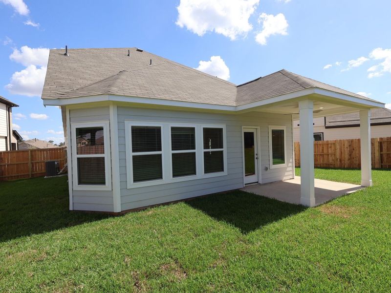 Front exterior of a new home in Moran Ranch, Willis, TX, highlighting curb appeal (Image 12). Front exterior of a new home in Moran Ranch, Willis, TX, highlighting curb appeal (Image 12).