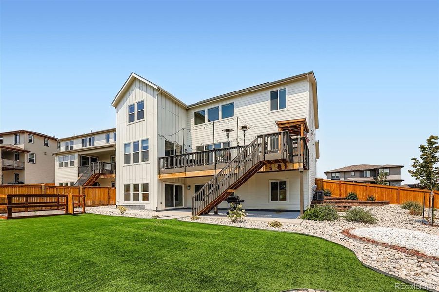 Front exterior of a new home in , Castle Pines, CO, highlighting curb appeal (Image 20).