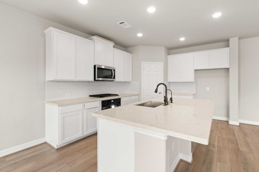 Kitchen. Note: Sample product photo - actual exterior and interior selections may vary by homesite