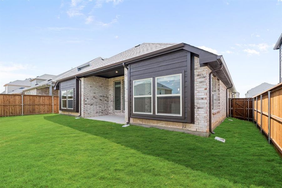 Exterior details and patio area of a home in Creekview Meadows, Pilot Point (Image 24).