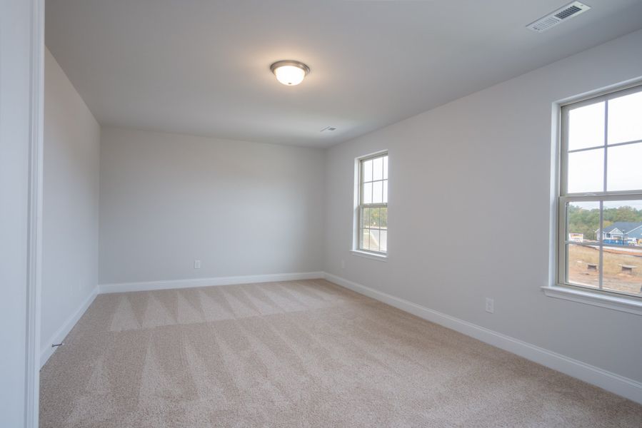 Representative unfurnished interior of a home built from the 3030 by Adams Homes in Parkland Place, Pace (Image 30).