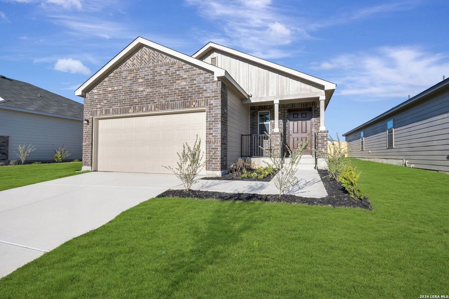 Front exterior of a new home in Park Place, New Braunfels, TX, highlighting curb appeal (Image 17).
