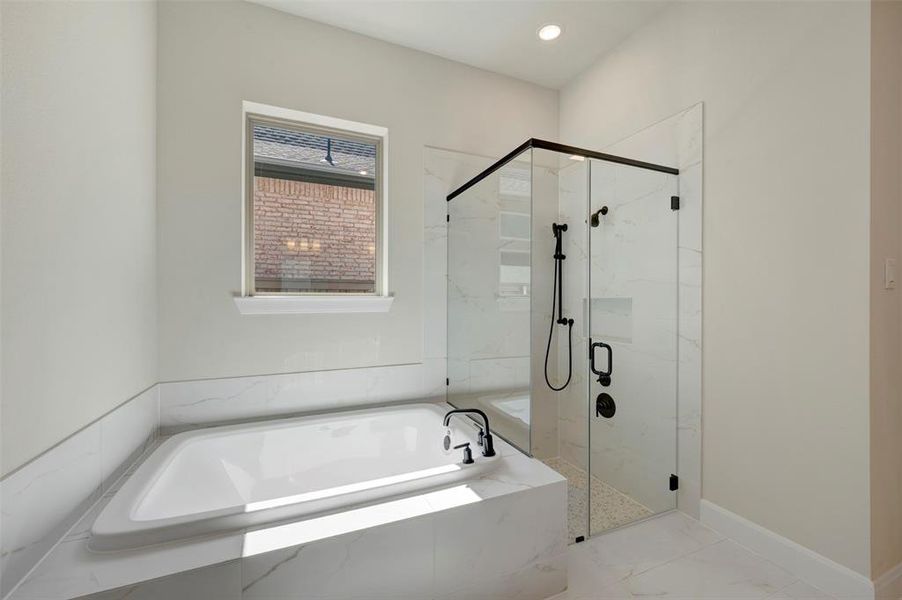 Full bath with a marble finish shower, a garden tub, and recessed lighting
