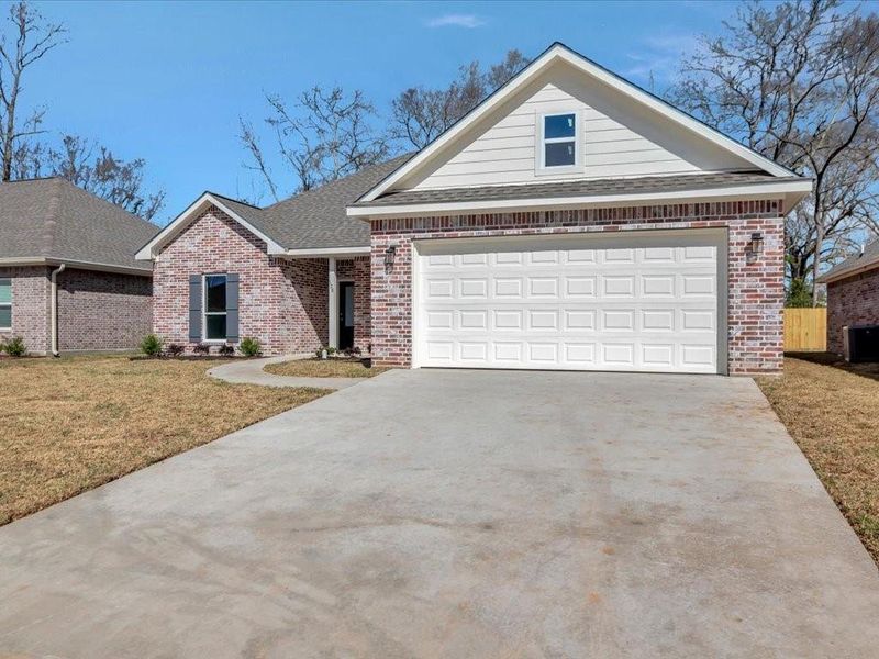 Front exterior of a new home in , Lufkin, TX, highlighting curb appeal (Image 1). Front exterior of a new home in , Lufkin, TX, highlighting curb appeal (Image 1).