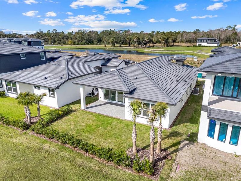 Exterior details and patio area of a home in Hampton Green at Providence, Davenport (Image 29).