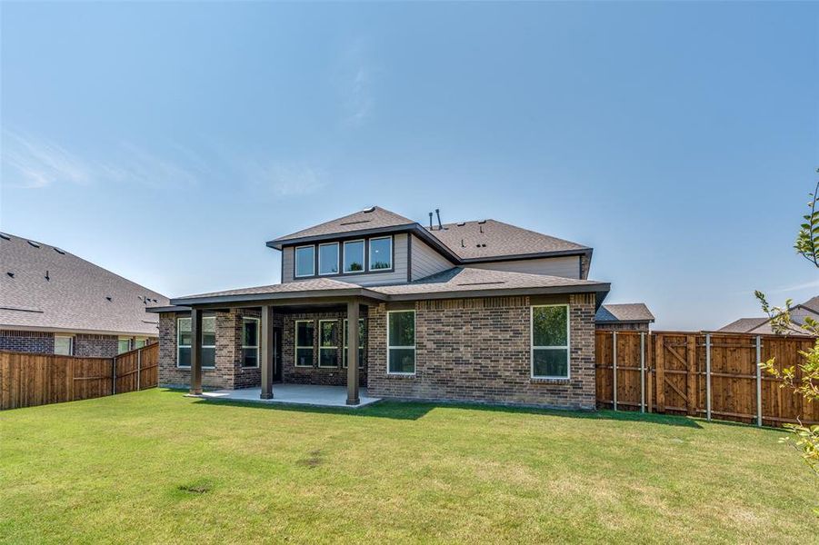 Front exterior of a new home in The Preserve Estates, Justin, TX, highlighting curb appeal (Image 2). Front exterior of a new home in The Preserve Estates, Justin, TX, highlighting curb appeal (Image 2).