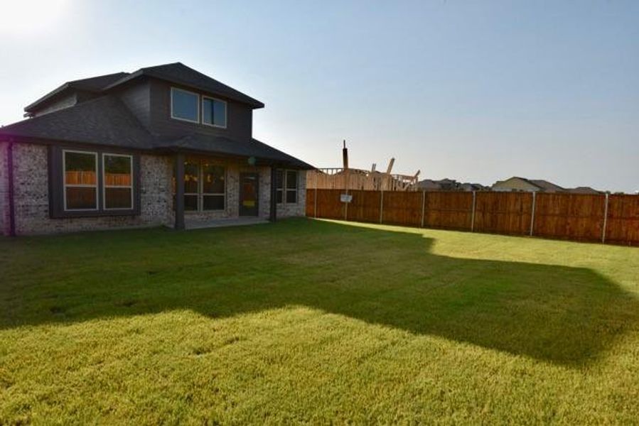 Back of property with a patio and brick siding Back of property with a patio and brick siding