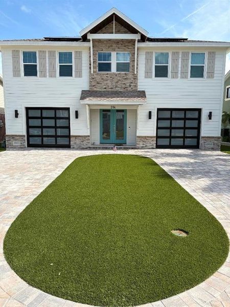 Front exterior of a new home in , Indian Rocks Beach, FL, highlighting curb appeal (Image 2). Front exterior of a new home in , Indian Rocks Beach, FL, highlighting curb appeal (Image 2).