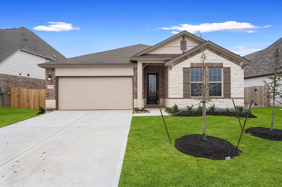 Welcome home to 31721 Redbud Blossom Lane located in the community of The Meadows at Imperial Oaks zoned to Conroe ISD.