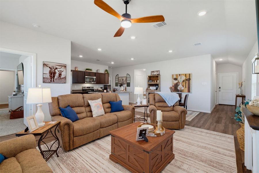 An open floorplan seamlessly connects the comfortable living area directly into the modern kitchen. An open floorplan seamlessly connects the comfortable living area directly into the modern kitchen.