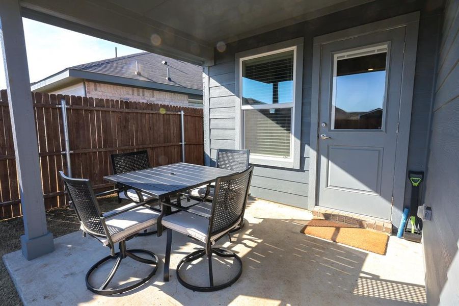 View of patio / terrace featuring fence and outdoor dining area