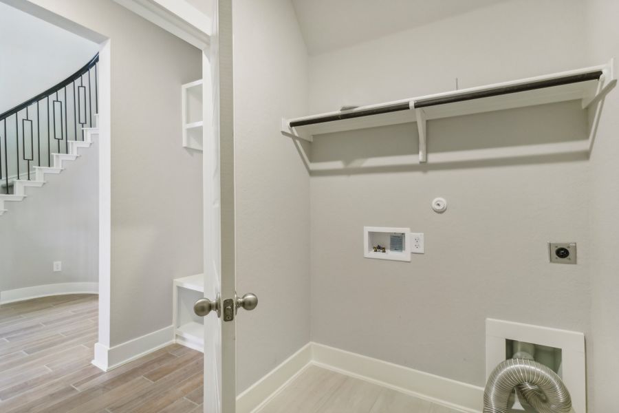 Laundry room in the Cedar floorplan at a Meritage Homes community.