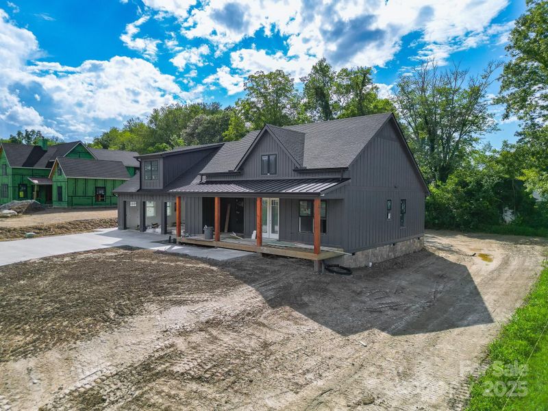 Front exterior of a new home in , Mills River, NC, highlighting curb appeal (Image 21).