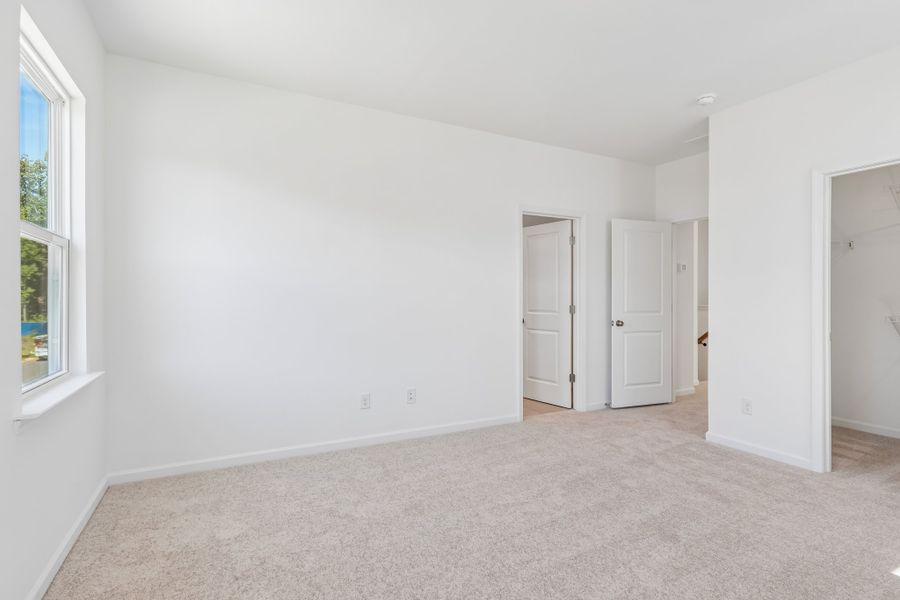 Spacious, unfurnished interior of a new home in Terraces at the Exchange, Indian Land (Image 25).