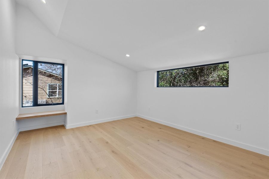 One of the secondary bedrooms upstairs has a built in window bench and ensuite bathroom