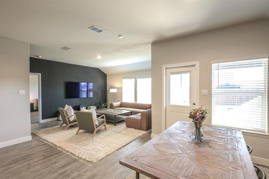 Dining area featuring lofted ceiling