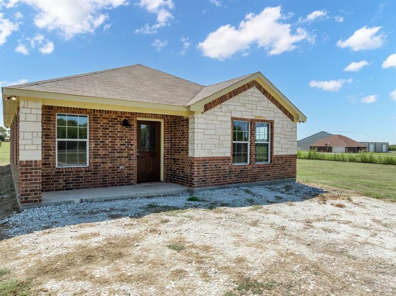 Front exterior of a new home in , Itasca, TX, highlighting curb appeal (Image 15). Front exterior of a new home in , Itasca, TX, highlighting curb appeal (Image 15).