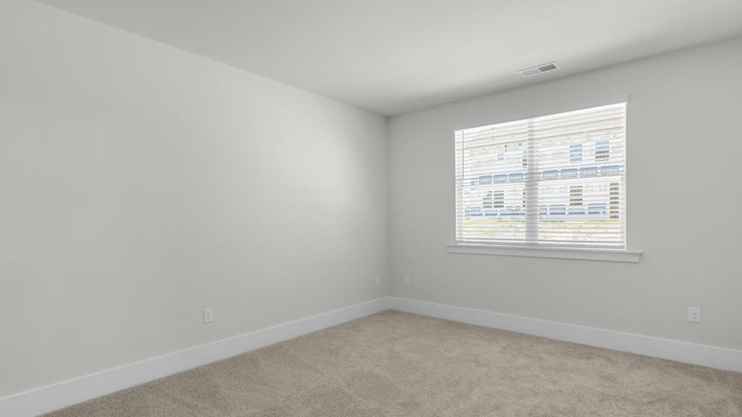 Spacious, unfurnished interior of a new home in Surfside Landing, Hubert (Image 18).