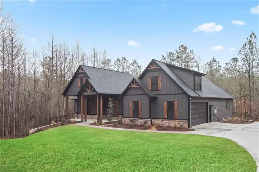 Front exterior of a new home in , Carrollton, GA, highlighting curb appeal (Image 21).