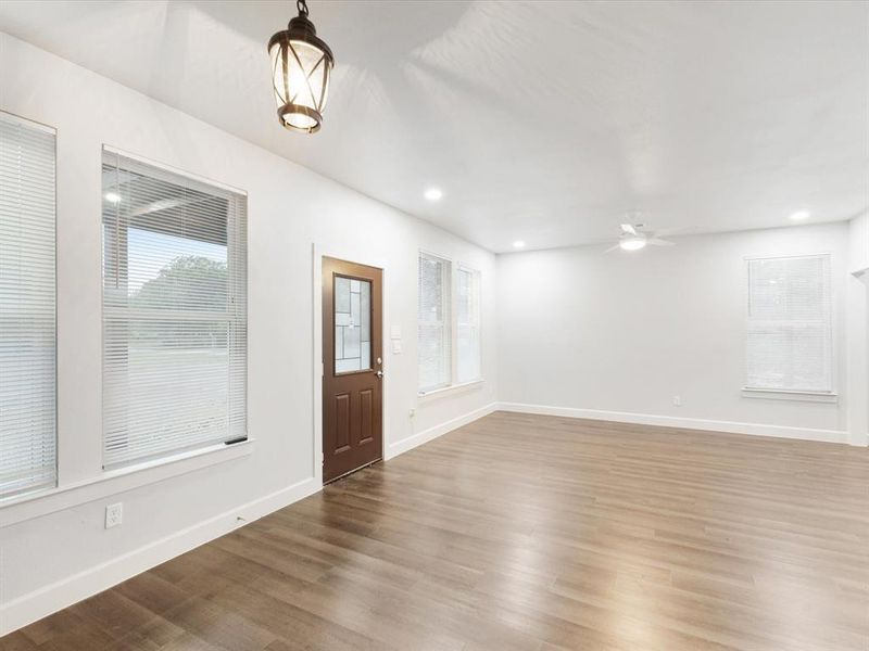 Entryway with wood finished floors, a ceiling fan, recessed lighting, and healthy amount of natural light