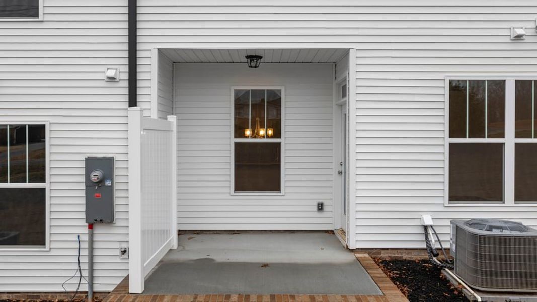 Exterior details and patio area of a home in Pearson Road Townhomes, Easley (Image 20).