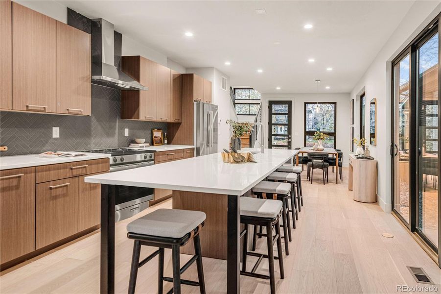 Gourmet kitchen with extended-length island.