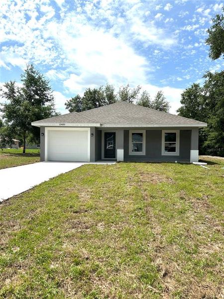 Front exterior of a new home in , Dunnellon, FL, highlighting curb appeal (Image 10). Front exterior of a new home in , Dunnellon, FL, highlighting curb appeal (Image 10).