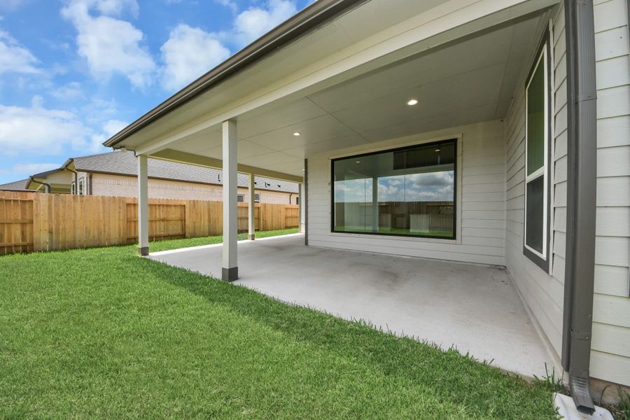 Discover the charm of this spacious backyard featuring a delightful covered patio. With ample room for both play and relaxation, it's the perfect outdoor haven. Tailor this space to your liking with patio furniture, a BBQ pit, and more. The potential for creating your dream outdoor living area is limitless! Discover the charm of this spacious backyard featuring a delightful covered patio. With ample room for both play and relaxation, it's the perfect outdoor haven. Tailor this space to your liking with patio furniture, a BBQ pit, and more. The potential for creating your dream outdoor living area is limitless!