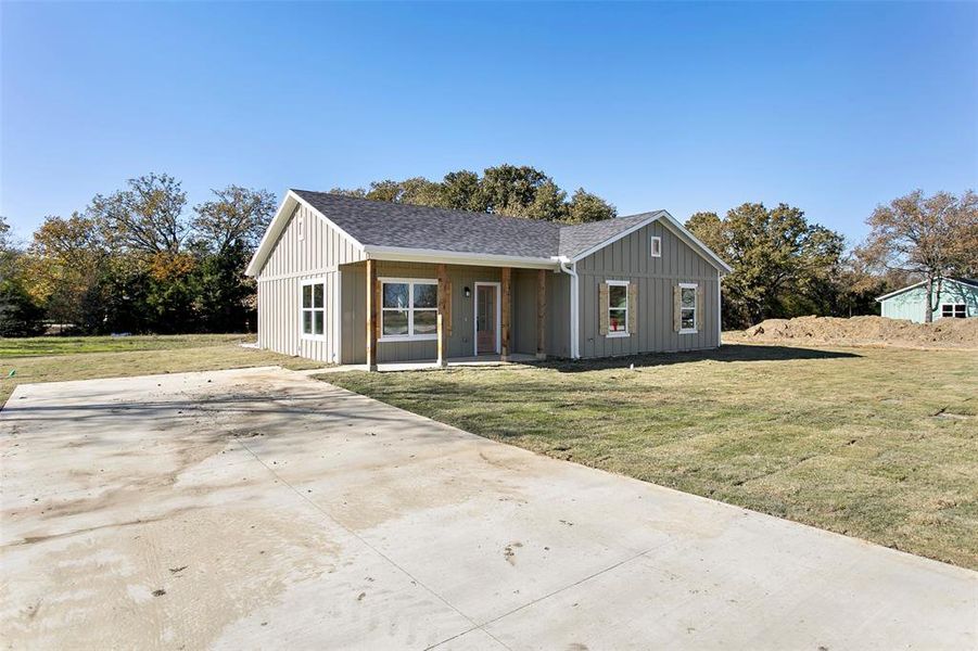 View of front of property with a front yard