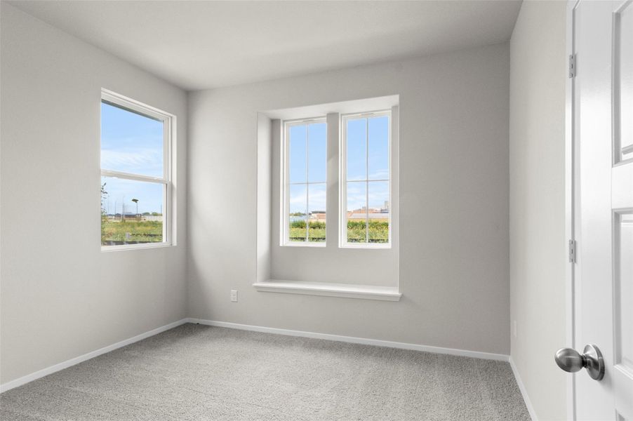 Carpeted empty room with plenty of natural light
