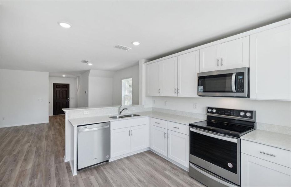 Bright kitchen with ample cabinet space *real home pictured