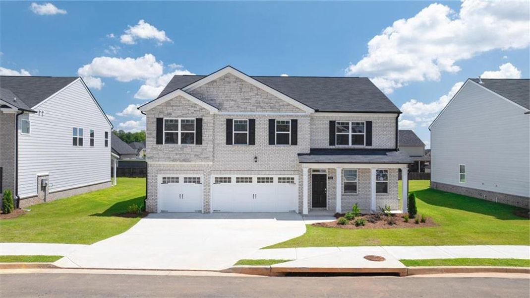 Front exterior of a new home in The Gates at Pates Creek, Hampton, GA, highlighting curb appeal (Image 22).