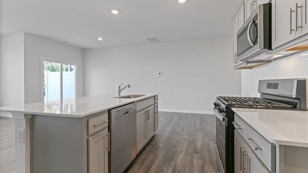 Representative furnished interior of a home built from the LANSING - TRADITIONS by D.R. Horton in Chapel Townes, Raleigh (Image 8).