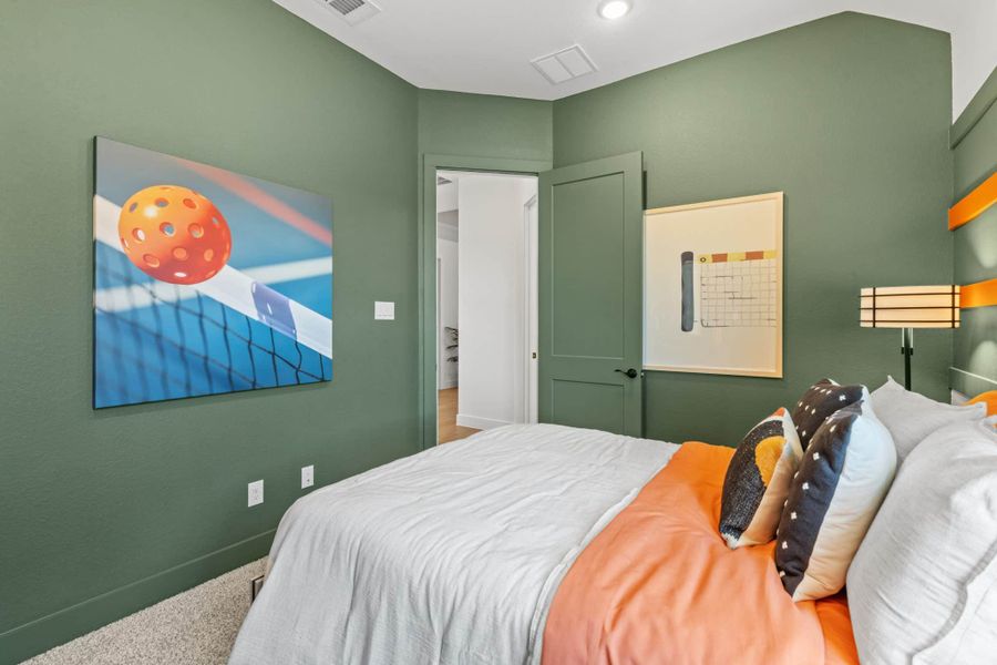 Representative furnished interior of a home built from the Aubrey by Chesmar Homes in Sienna, Missouri City (Image 34).