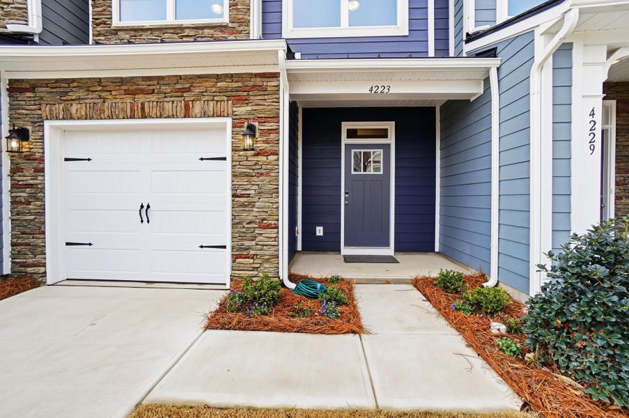 Exterior details and patio area of a home in Harrisburg Village Townhomes, Harrisburg (Image 3).