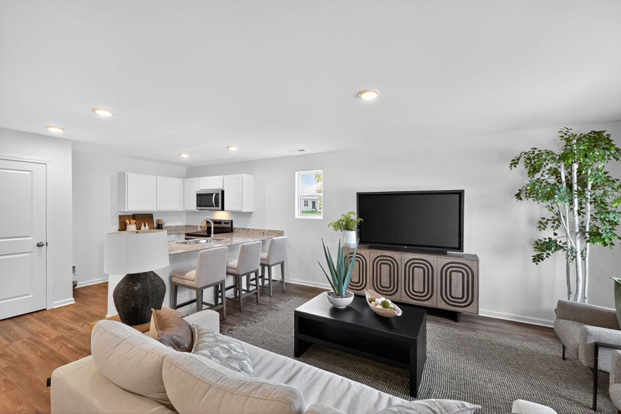 A living room with a tv and couches.