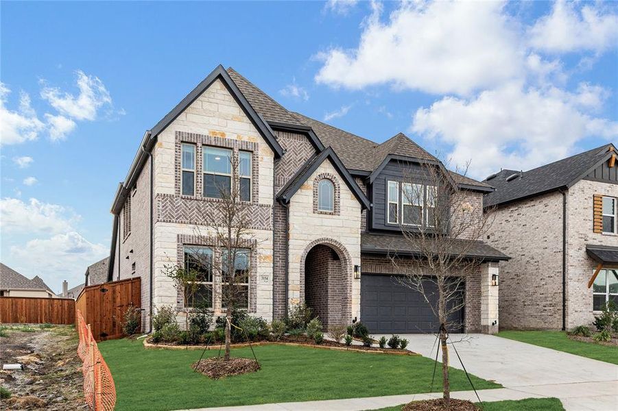 Front exterior of a new home in Waterscape Classic 50s, Royse City, TX, highlighting curb appeal (Image 2). Front exterior of a new home in Waterscape Classic 50s, Royse City, TX, highlighting curb appeal (Image 2).