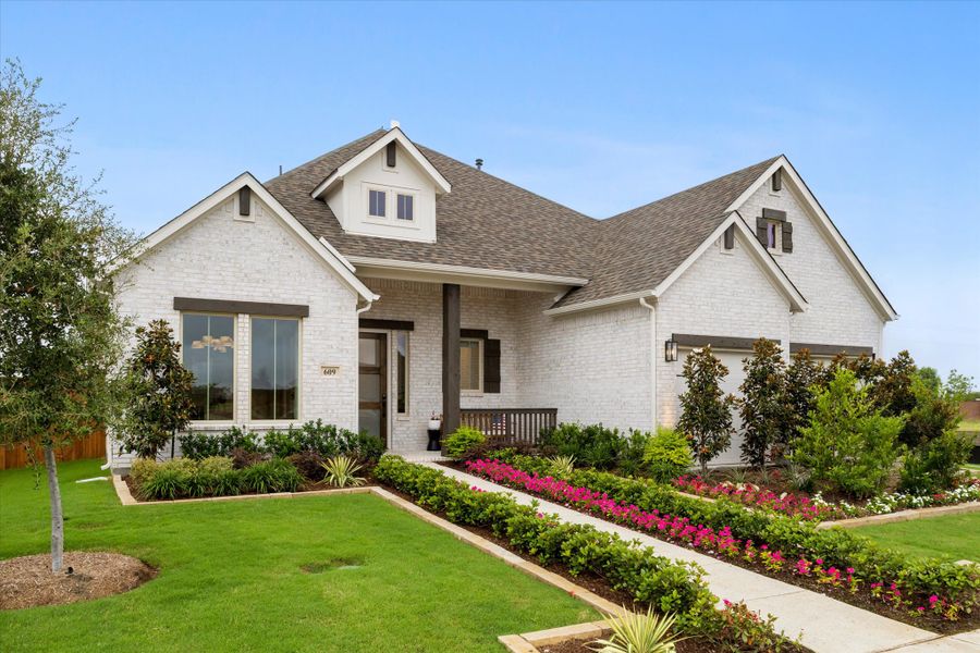 Front exterior of a new home in River Ranch, Van Alstyne, TX, highlighting curb appeal (Image 2).