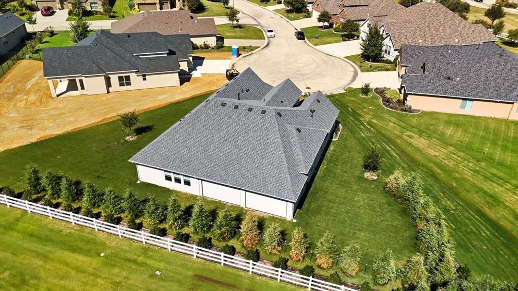 Single-story residence featuring a multi-gabled roofline with dark gray shingles
