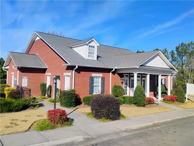 Front exterior of a new home in , Calhoun, GA, highlighting curb appeal (Image 1).