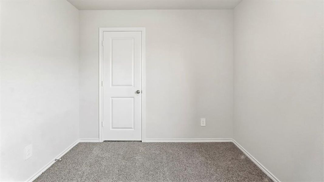 Spare room with carpet and baseboards Spare room with carpet and baseboards