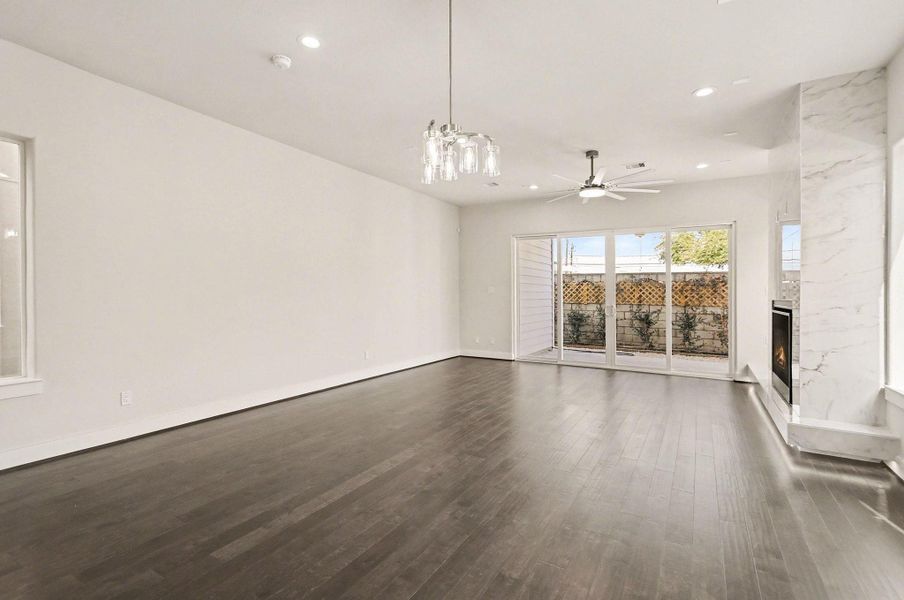 Large sliding glass doors provide effortless indoor-outdoor living and backyard access.