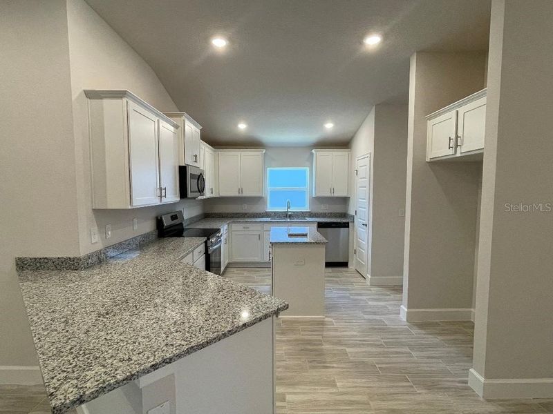 Furnished interior view inside a new home in Abbey Glen, Dade City (Image 3).